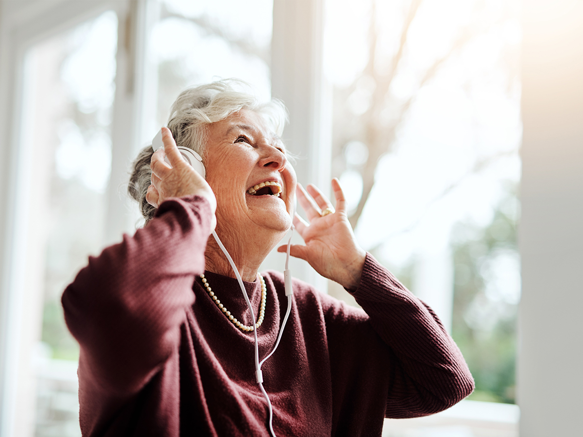 Senior woman listening to music