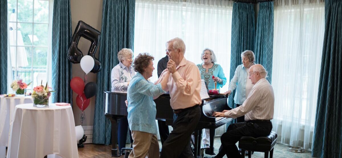 Residents dancing and playing the piano